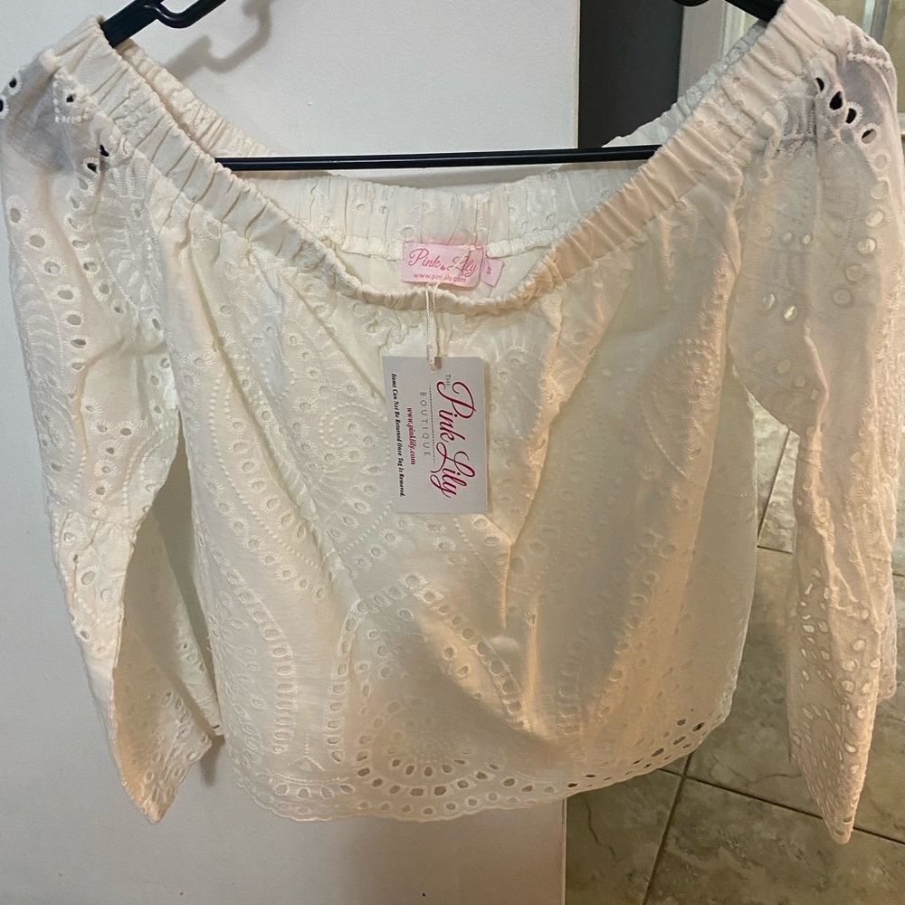 White off the shoulder shirt.